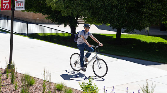 Student biking around campus