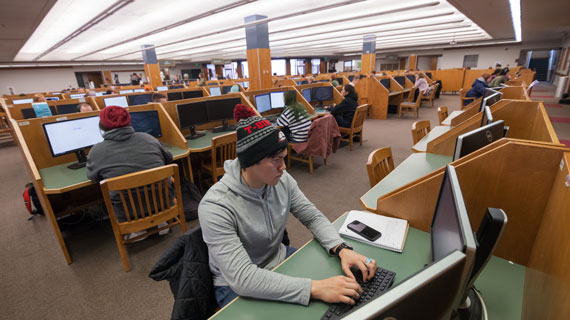 Students using computers in library