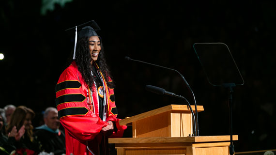 D'Mia Lamar speaking at graduation