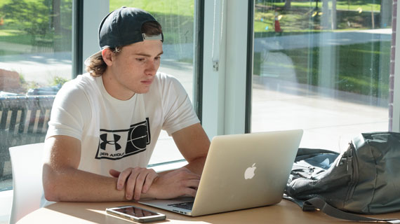 student studying in the business building