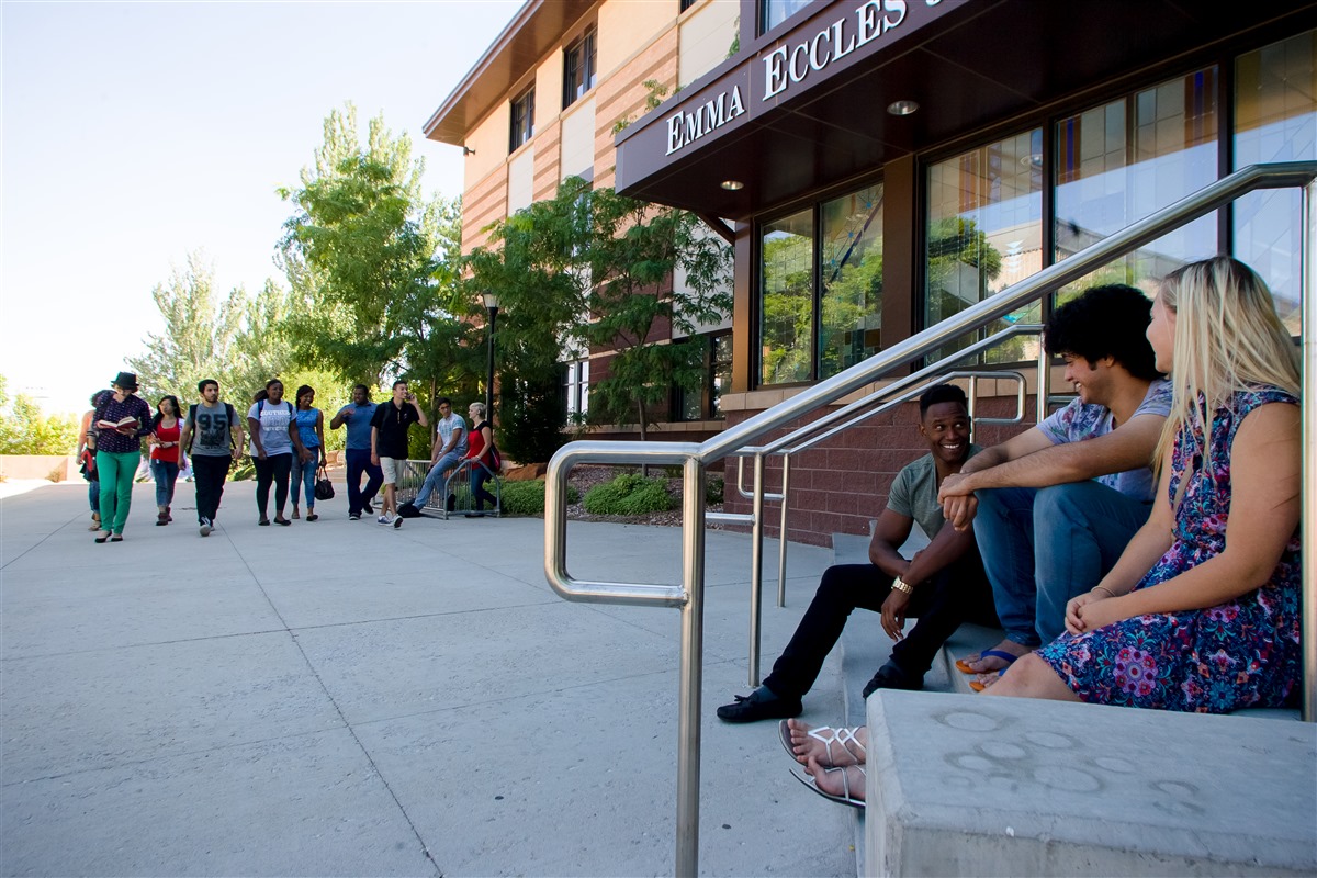 Students sitting outside the education building 8