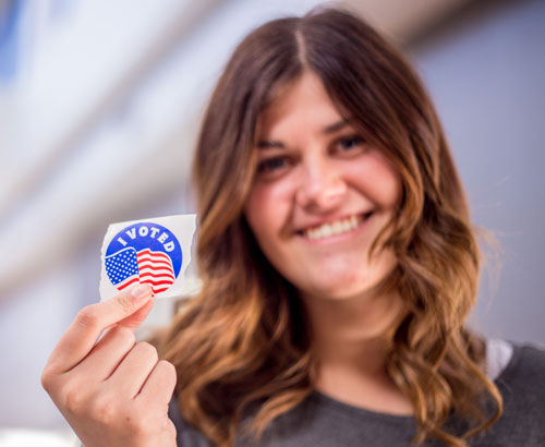 Student with i voted sticker