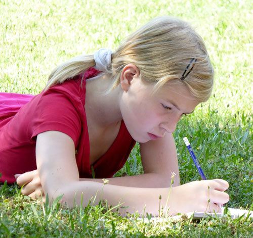 Teen girl writing a story