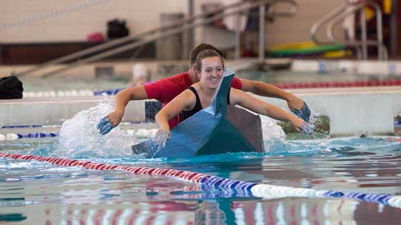 Engineering students build cardboard boats and race in the SUU pool