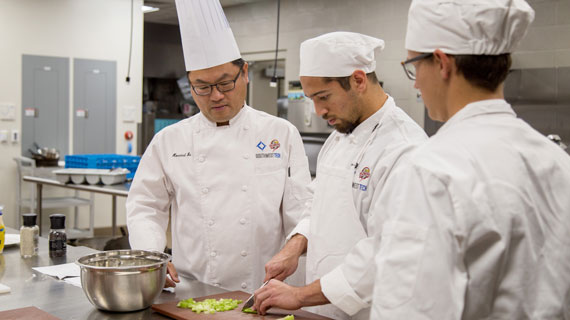 SUU Hospitality Professor Howard Hu teaching a culinary class in the dual enrollment program