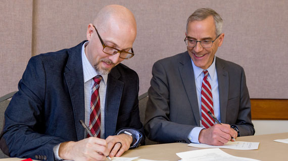 President Scott Wyatt and President Brennan Wood signing the Southern Utah University and Southwest Technical College Dual Enrollment Partnership